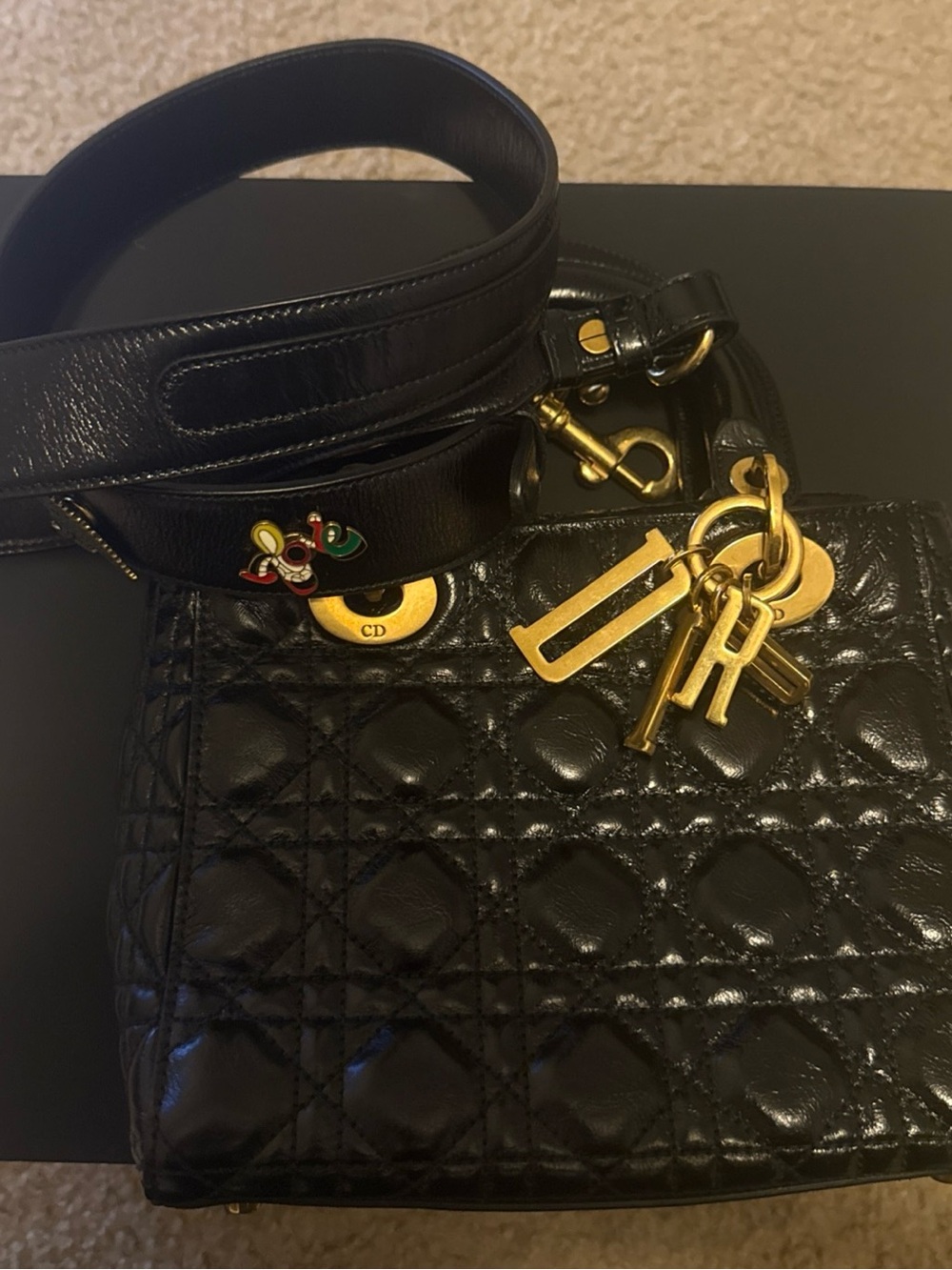 Dior Black Quilted Shoulder Bag with Gold Hardware and Charm